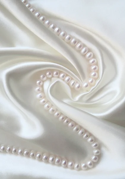 Smooth elegant white silk with pearls — Stock Photo, Image