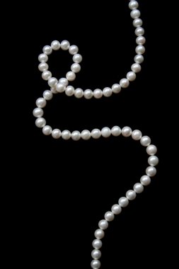 White pearls on a black velvet clipart