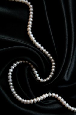 White pearls on the black velvet clipart