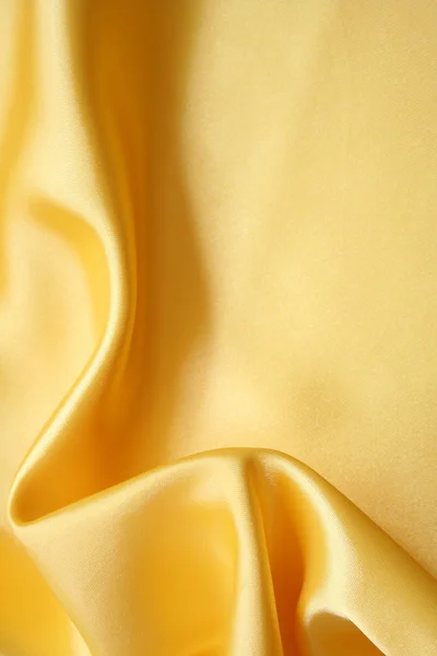 Smooth elegant golden silk — Stock Photo, Image