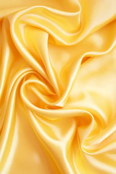 Hladké elegantní zlaté hedvábí — Stock fotografie