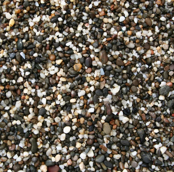 Färgglada stenar på stranden — Stockfoto