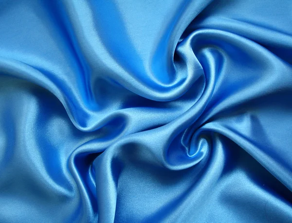 Hladké elegantní modré hedvábí — Stock fotografie