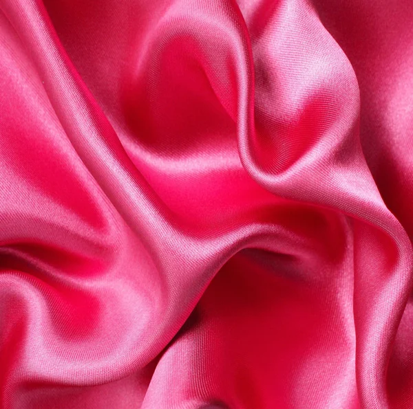 Hladké elegantní červeného hedvábí jako pozadí — Stock fotografie