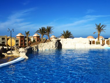 Swimming-pool with turquoise water under open-skies clipart