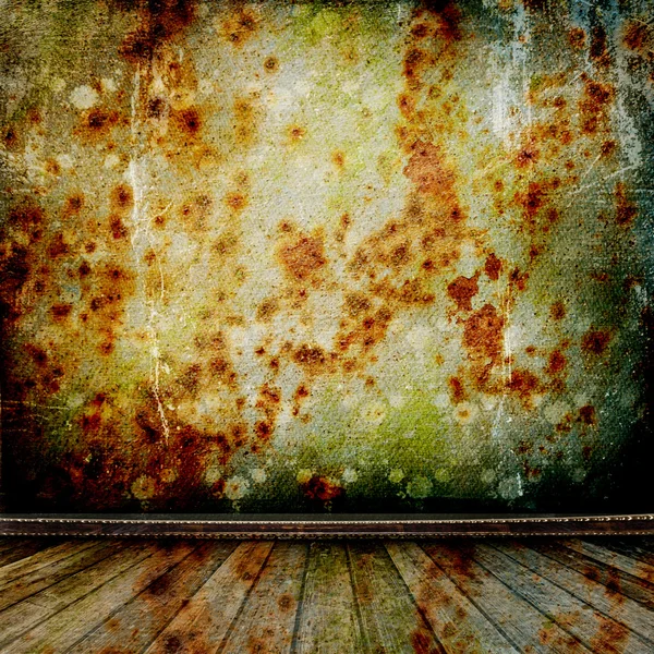 A rusty metal wall in the old room with wooden floor — Stock Photo, Image