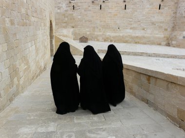 Three women in yashmak clipart