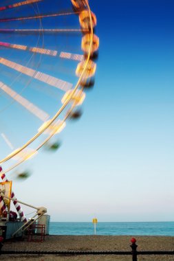 Ferris wheel at the beach clipart