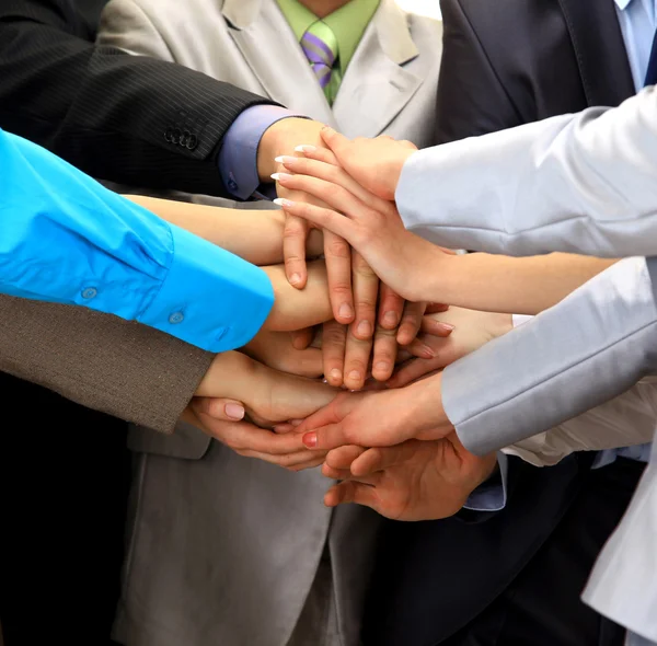 stock image Group of business making a pile