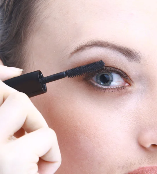 Young woman applying mascara using lash — Stock Photo, Image