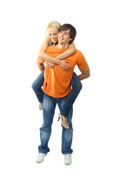 Glad ung kvinna njuter en piggyback — Stockfoto