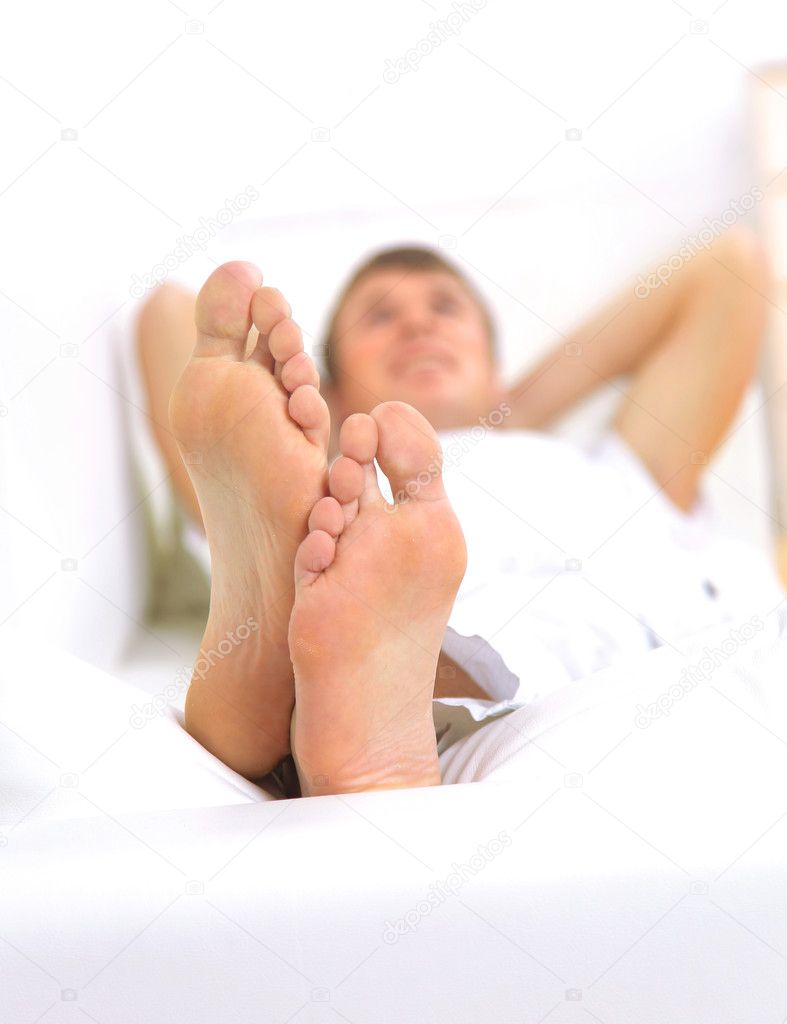 Macro of man's feet, man resting
