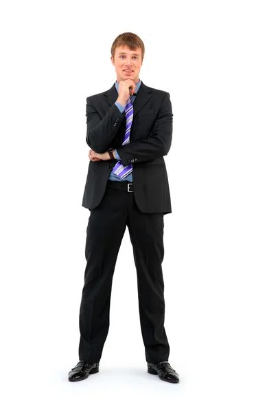 Comprimento total de um jovem empresário sorridente em pé contra branco isolado — Fotografia de Stock