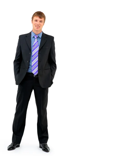 Young businessman standing against isolated white background — Stock Photo, Image