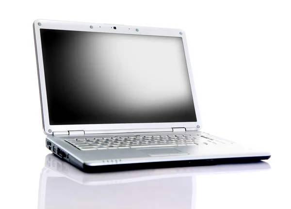 Modern laptop isolerade på vitt med reflektioner på glasbord. — Stockfoto