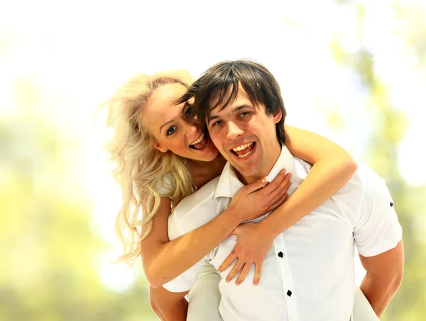Happy smiling couple in love. Over white background — Stock Photo, Image