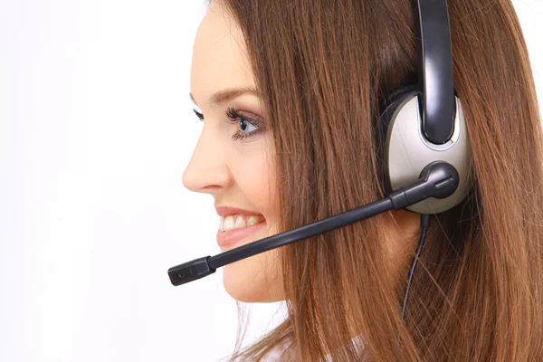 Frau mit Headset im Büro; könnte Empfangsdame sein — Stockfoto