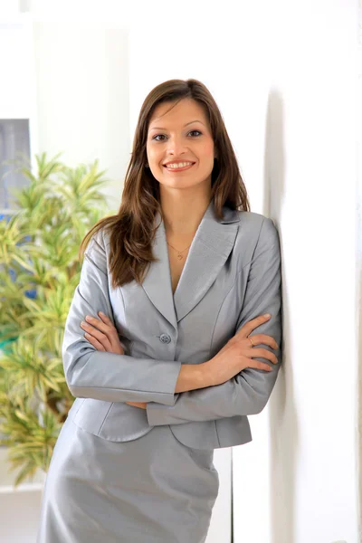 Portrait of a beautiful business woman holding a portfolio — Stock Photo, Image