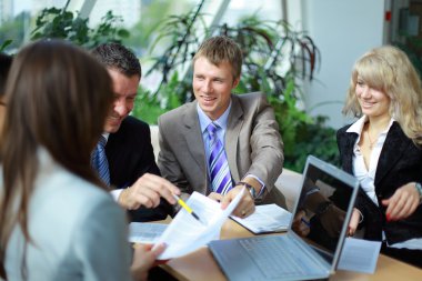 Workgroup interacting in a natural work environment clipart