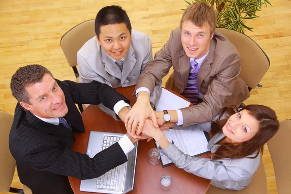 Businessteam and hands on top of each other — Stock Photo, Image