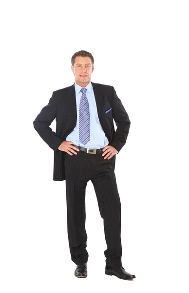 Full length portrait of a successful mature business man with hands folded — Stock Photo, Image