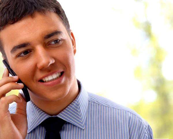 Young businessman using mobile phone — Stock Photo, Image