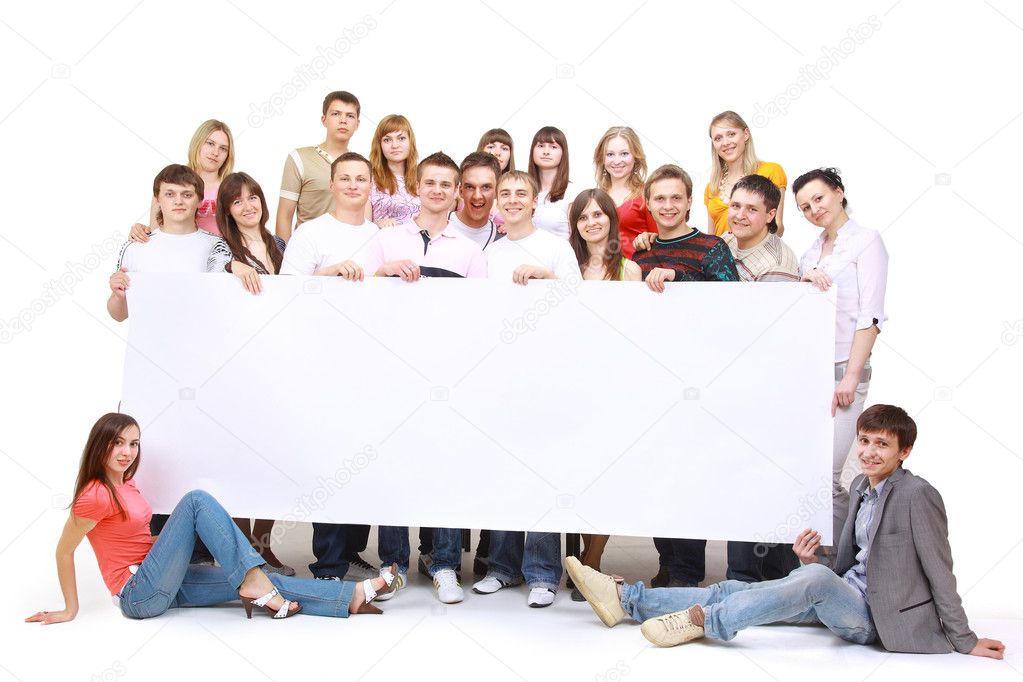 Portrait of happy men and women standing with a billboard against white background