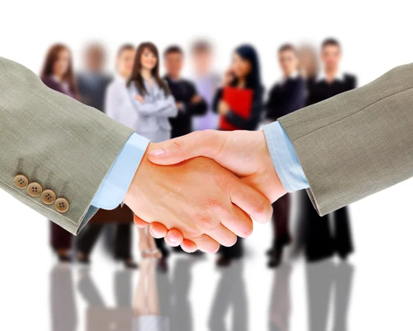 Handshake e equipe de negócios — Fotografia de Stock