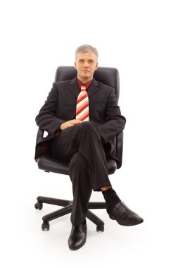 Isolated portrait of a senior businessman sitting on a chair clipart