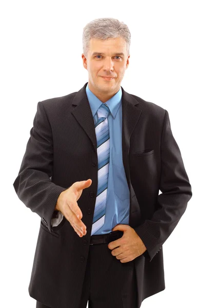 Homem de negócios com uma mão aberta pronto para fechar um negócio — Fotografia de Stock