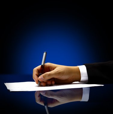 Businessman's hand with pen clipart