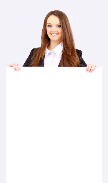 Aislamiento de una mujer de negocios de pie junto a un tablero en blanco —  Fotos de Stock