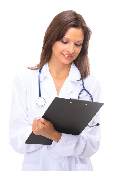 Portrait of happy successful mature female doctor holding a writing pad — Stockfoto