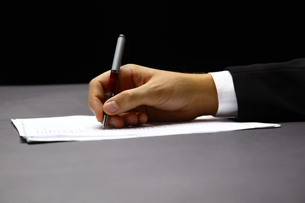 Businessman's hand with pen — Stock Photo, Image