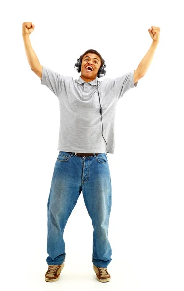 Young happy man listening to music and singing — Stock Photo, Image