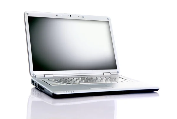 Modern laptop isolerade på vitt med reflektioner på glasbord. — Stockfoto