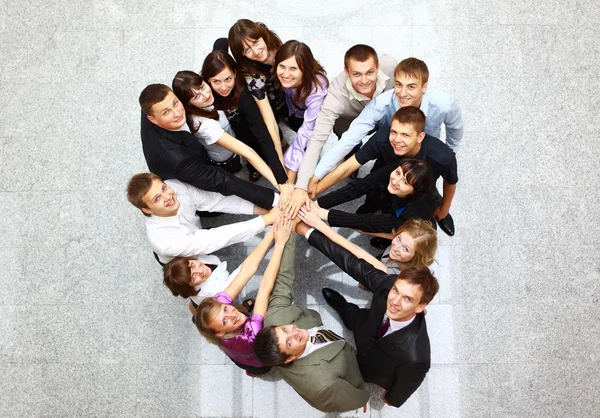 Top view of business with their hands together in a circle Stock Image