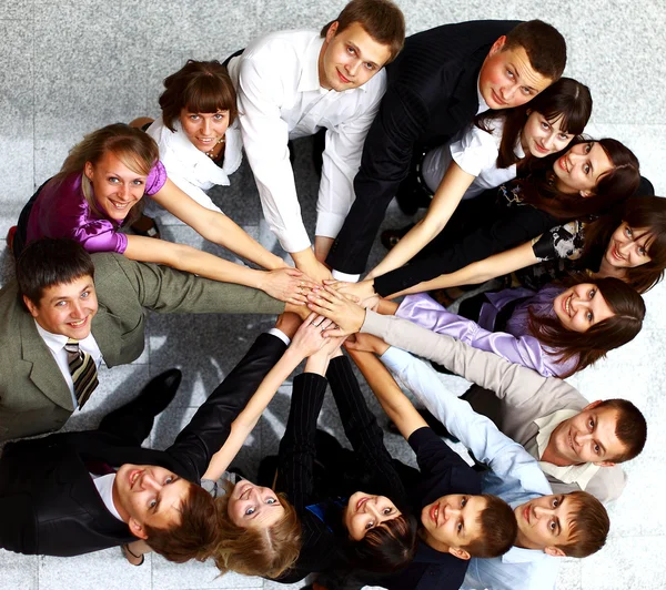 Top view of business with their hands together in a circle Stock Photo