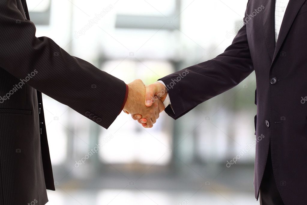 Handshake isolated on blue background