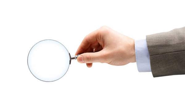 Magnifying glass in hand isolated over white background