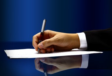 Businessman's hand with pen clipart