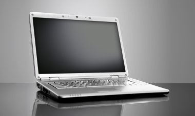 Modern laptop isolated on black background clipart