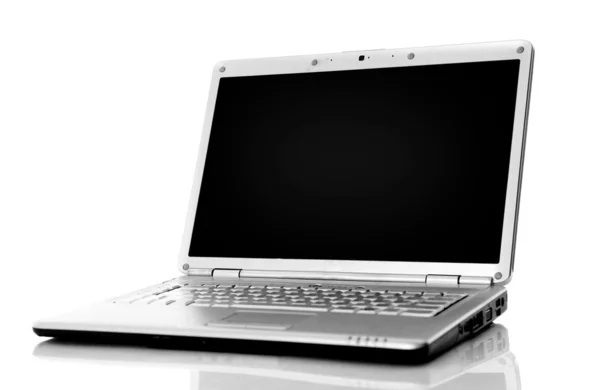 Laptop moderno isolado em branco com reflexões sobre mesa de vidro . — Fotografia de Stock