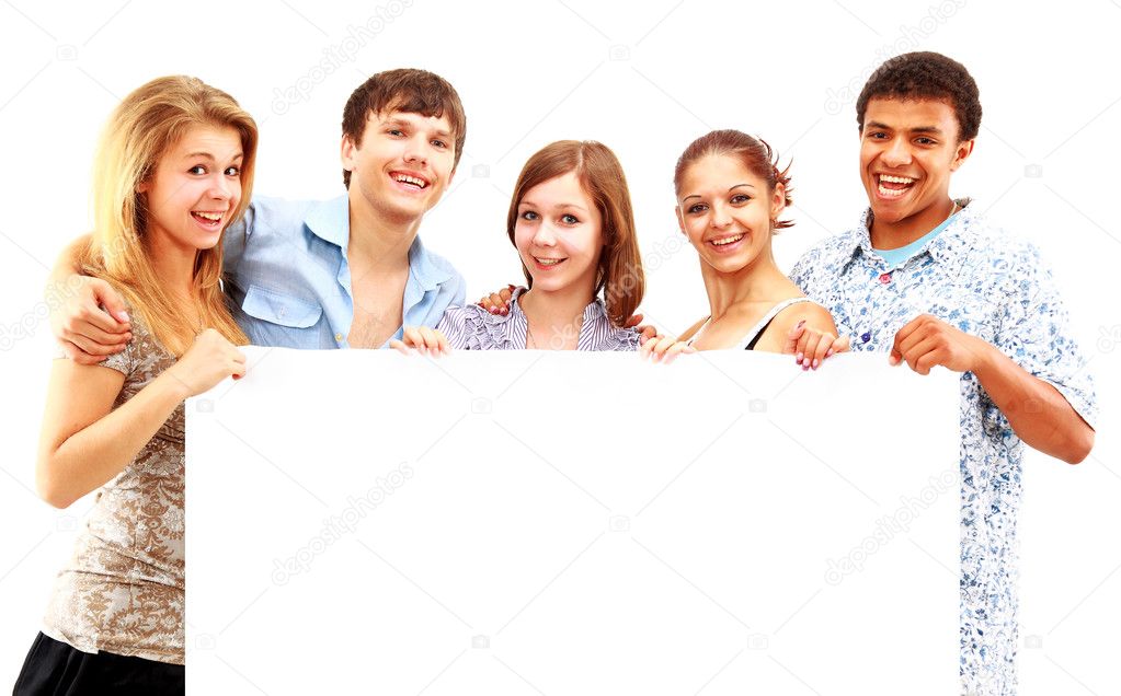 Happy group of casual friends holding a banner add isolated on white