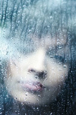 Sad young woman and a rain drops clipart