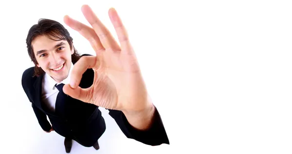 Молодий бізнесмен піднімається на великий палець, ізольований на білому — стокове фото