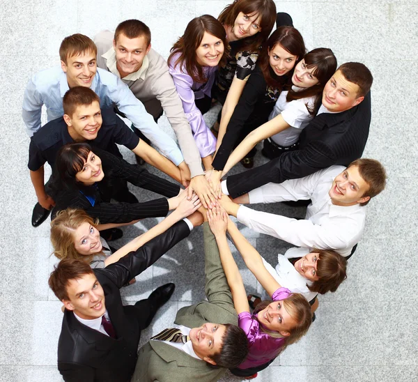 Top view of business with their hands together in a circle Stock Picture