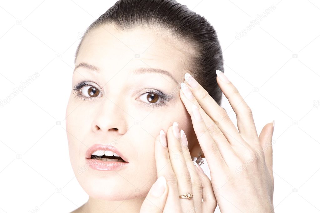 Woman's face with the wrinkles on her forehead