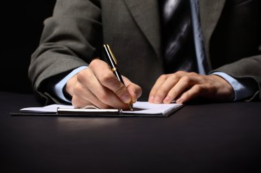 Businessman's hand with pen
