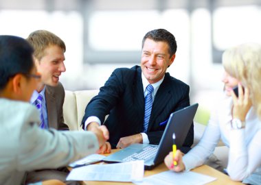 Business shaking hands, finishing up a meeting clipart